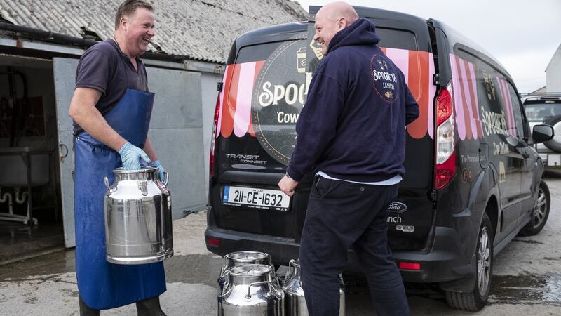 Denis Vaughan (right) ollecting  milk from farmer Patrick Lacey to make Spooney’s ice-cream.  Photograph:  Paul Sherwood