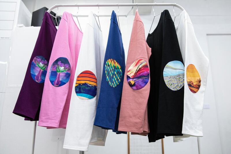 T-shirts designed by IStory feature patch designs with drawings conceptualised from the stories of North Korean re-settlers. Photograph: Woohae Cho/The New York Times