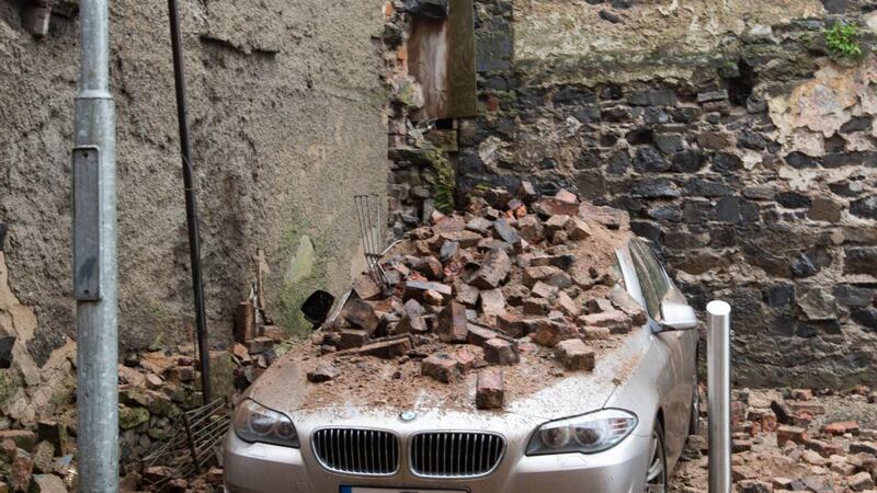 A BMW car was destroyed when bricks from a wall came down from a building during Storm Darwin in Limerick. Photograph:  Sean Curtin Photo