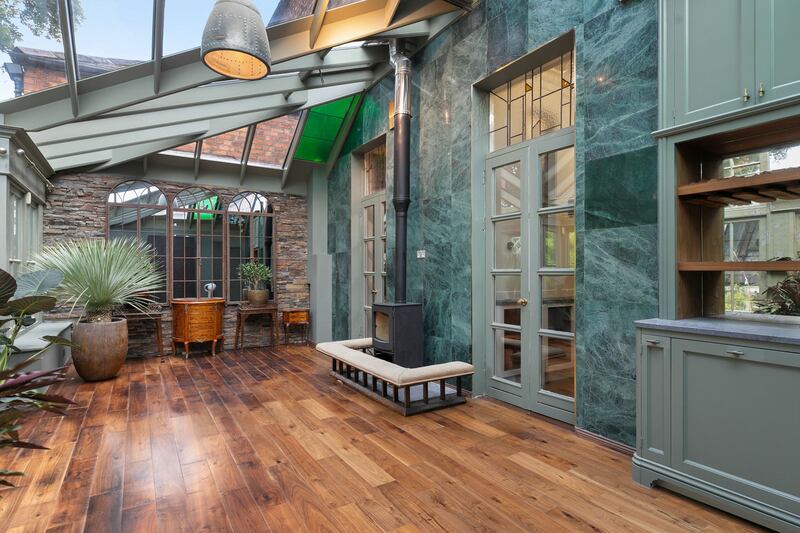 Hamptons conservatory with feature Verde marble wall