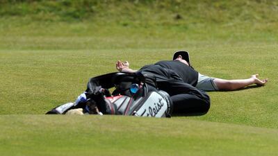 Rory McIlroy has a rest during the second day of the 2010 Open Championship at St Andrews after play was suspended due to high winds. Photo: Getty Images