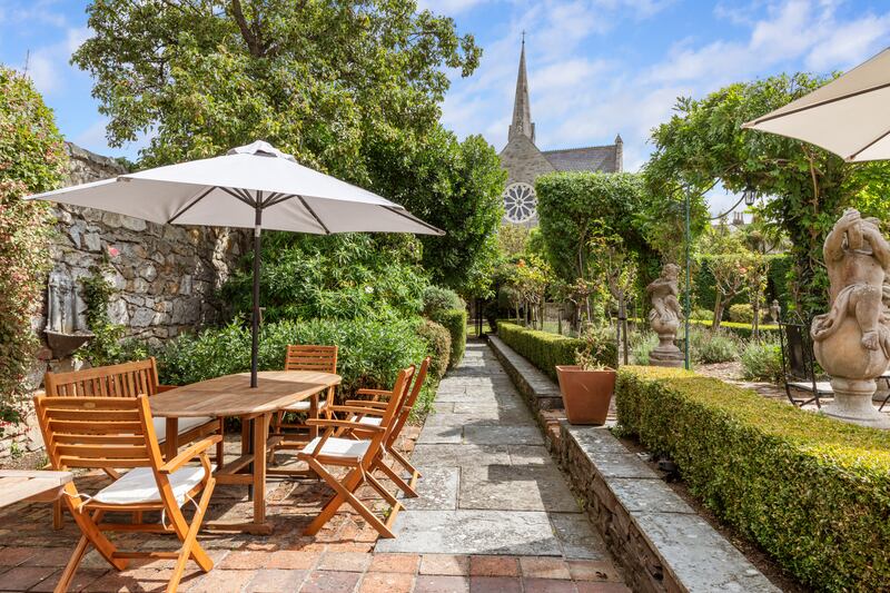 Garden seating area with fruit trees