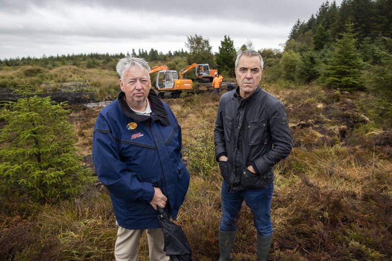 Oliver McVeigh (left ) brother of Columba McVeigh and Jimmy Nesbitt (right) patron of WAVE Trauma Centre, visiting the search site. Photograph: Liam McBurney/PA