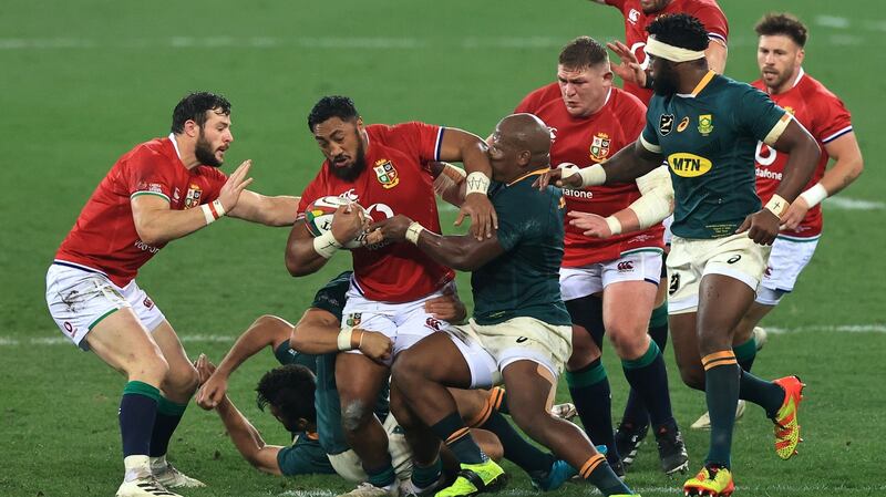 Bundee Aki  is tackled by Bongi Mbonambi of South Africa during the third Test. Photograph: David Rogers/Getty Images