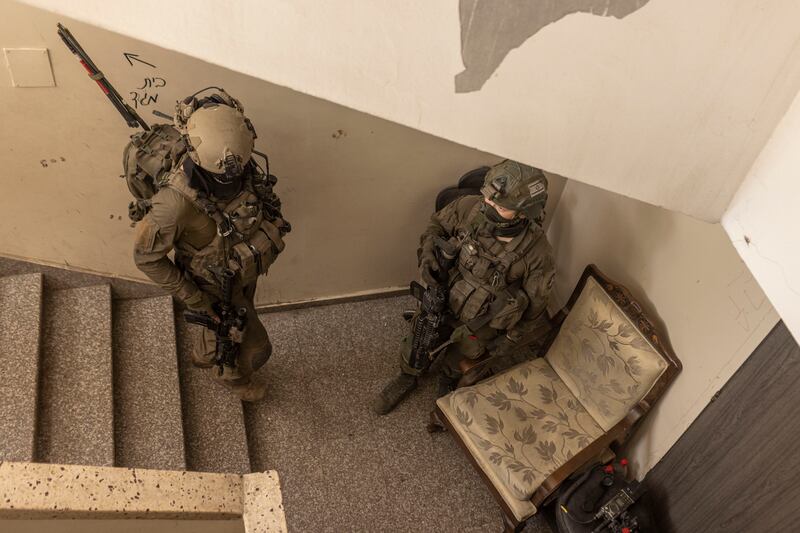 Israeli soldiers from Flotilla 13, a commando unit, in a private clinic outside Shifa Hospital in Gaza City. Photograph: Avishag Shaar-Yashuv/New York Times
                      