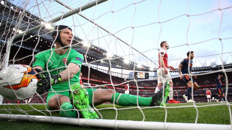Petr Cech takes the ball from the net after Mouctar Diakhaby put Valencia ahead. Photo: Eddie Keogh/Reuters