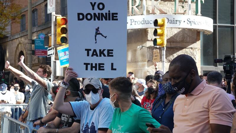 People celebrate at Times Square in New York after Joe Biden was declared winner. Photograph:  Bryan R Smith/Afp/AFP via Getty Images)