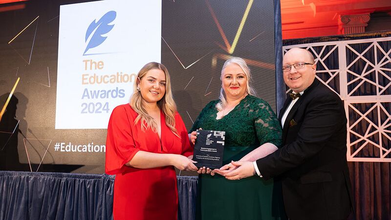 Lily Rowntree, entries lead at Business River, presents the student engagement & communications award to Fintan Breen and Kaye Morrissey, University of Limerick, Academic Registry