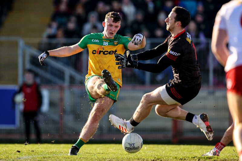 Donegal's Jeaic McKelvey comes up against goalkeeper Niall Morgan of Tyrone. Photograph: Ben Brady/Inpho