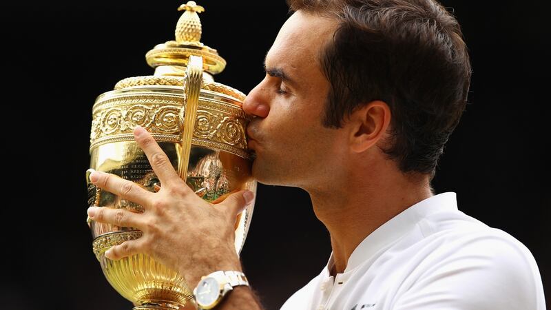 Roger Federer  celebrates victory  over Marin Cilic of Croatia as he claimed his eighth Wimbledon title. Photograph: Clive Brunskill/Getty Images