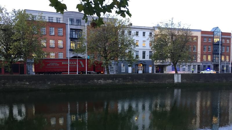The scene at Merchants Quay seen from the opposite side of the river. The southside quays were closed to traffic on Friday after a  lorry was in collision with a pedestrian. Photograph: Alan Betson/The Irish Times