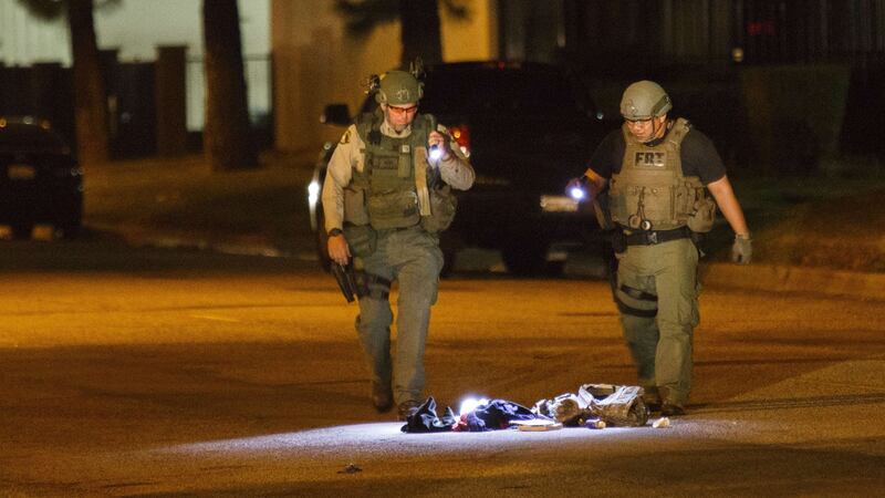 Officers investigate a suspicious bag, later found not to be a threat. Photograph: Patrick T Fallon/AFP/Getty Images