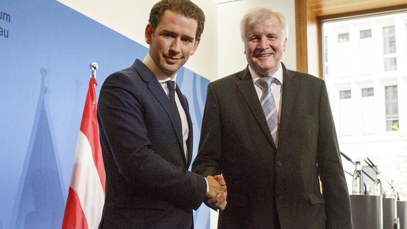 Austrian chancellor Sebastian Kurz (left) and German interior minister Horst Seehofer shake hands following a press conference  in Berlin on Wednesday. Phototgraph: Carsten Koall/Getty Images