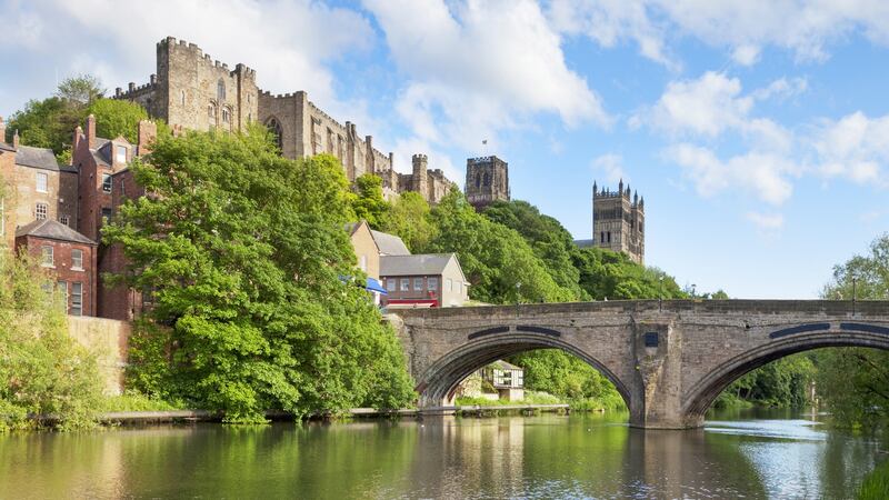 Durham Castle and Cathedral on their rock above the city, and Framwellgate Bridge spanning the River Wear. Photograph: iStock