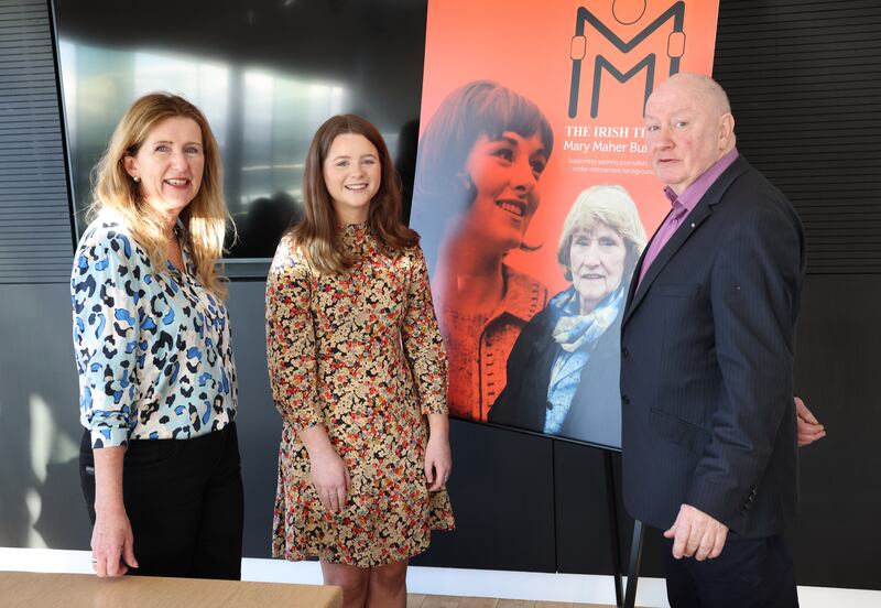Katie Mellett, centre, with Deirdre Veldon, The Irish Times, and Seamus Dooley, NUJ. Photograph: Dara Mac Dónaill