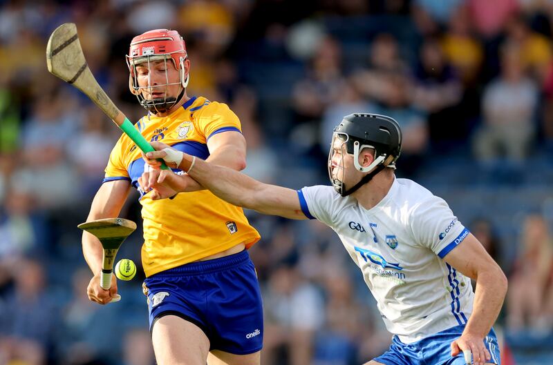 Clare’s Peter Duggan is tackled by Mark Fitzgerald of Waterford during their Munster SHC game on Saturday. Photograph: James Crombie