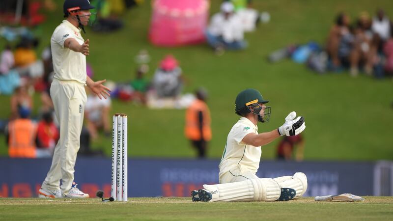 South Africa batsmen Anrich Nortje sits on the ground after avoiding a short ball from Jofra Archer as Jonny Bairstow looks on.  Photograph: Stu Forster/Getty Images
