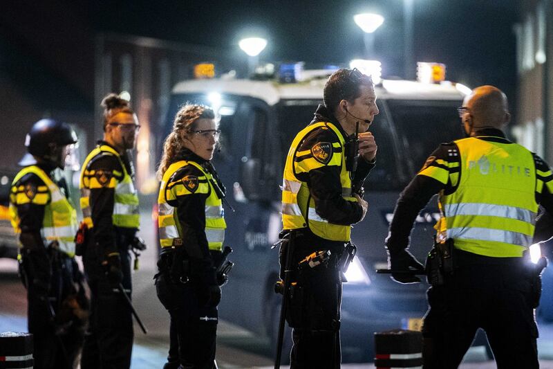Police on the street during riots in the De Kemp district in Roermond, Netherlands as rioting took place across country. Photograph: Rob Engelaar/EPA