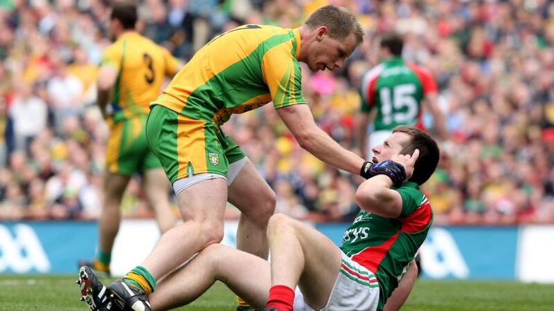 Let’s get physical:  Donegal’s Anthony Thompson and Cillian O’Connor of Mayo have words during last year’s All-Ireland football final. Photograph: Cathal Noonan/Inpho