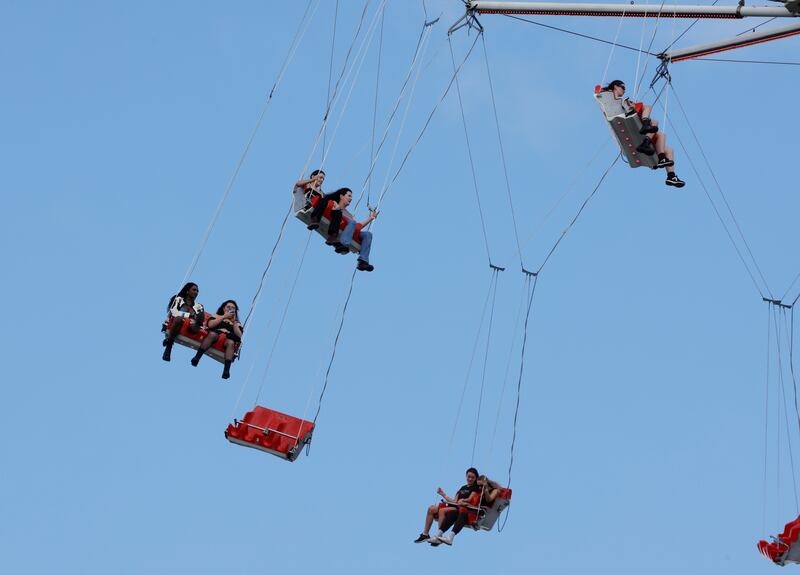 Patrons enjoy a carnival ride on the first day of Electric Picnic 2023. Photograph: Alan Betson