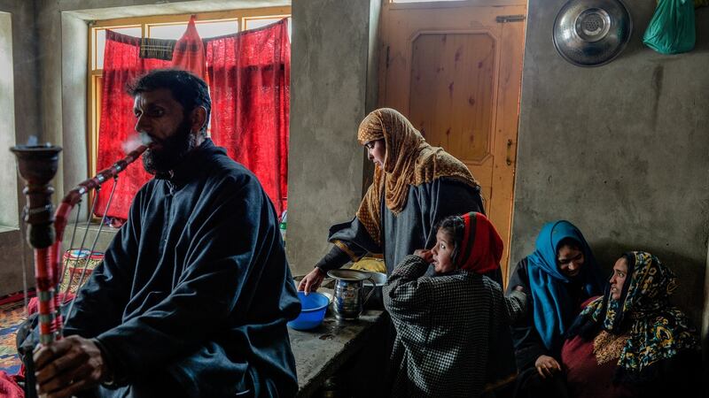 Sameer Tiger’s parents, Mohammed Maqbool Bhat and Gulshan Begum,  at home in Drabgam, India, in the state of Kashmir. Photograph: Atul Loke/New York Times