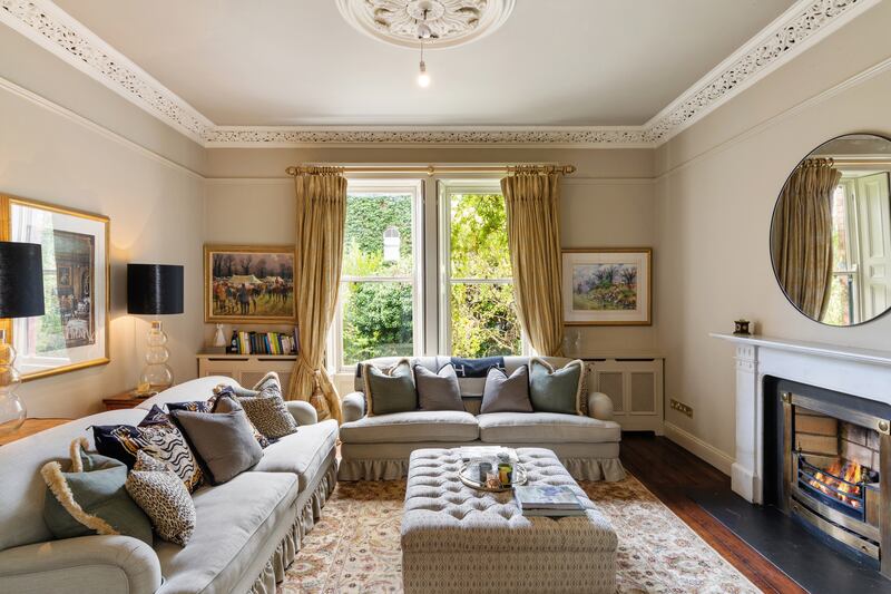 The formal drawingroom, with all of its period features intact, includes the original picture sash windows with working shutters.