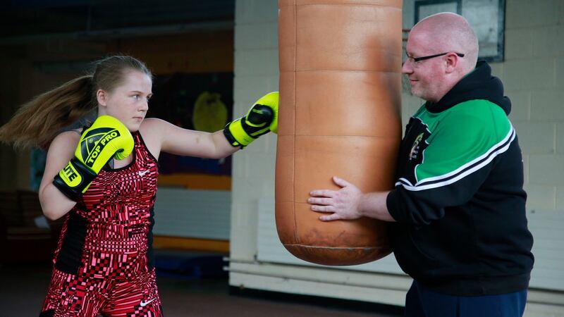 Gabrielle Mongan (13) from Ballyboden with coach Derek Delaney at Scoil Mhuire, Ballyboden, Dublin. Photograph: Nick Bradshaw