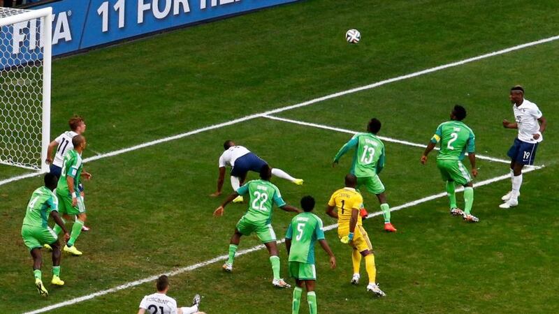 Players watch as France’s Paul Pogba (19) scores against Nigeria  at the Estadio Nacional in Brasilia. Photograph: Reuters