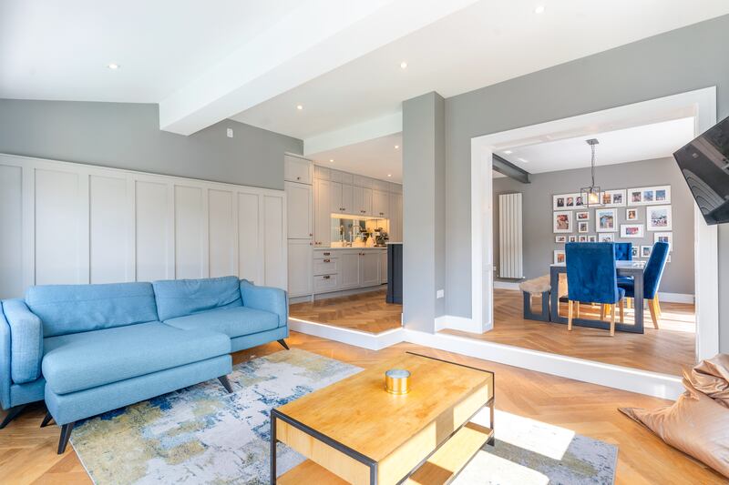 Extension is a sunken livingroom to the rear