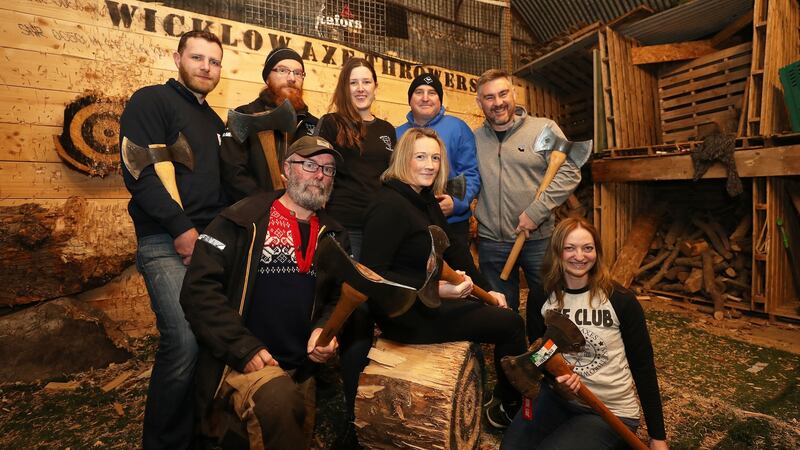 (Back row) Bruce Shiel, Matthias John, Ceola McGowan, Vaughan Mason, Matt Wilson with (front L-R) Ashley Glover, Fiona Alston and Oonagh McMorrow at axe-throwing training in Co Wicklow. Photograph: Nick Bradshaw