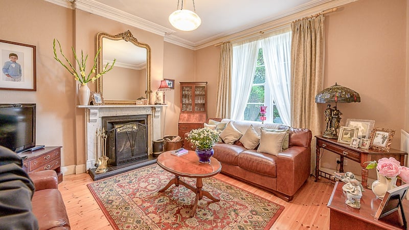 The house’s period features include timber sash windows, cast iron fireplaces and ceiling cornices.