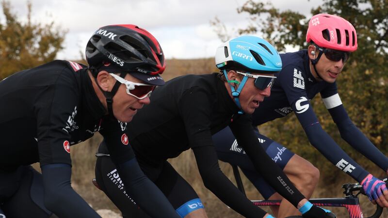 Dan Martin (centre) rides along with   Chris Froome (left) during stage 4 of the Vuelta a España  between Garray Numancia and Ejea de los Caballeros. Photograph: Kiko Huesca/EPA