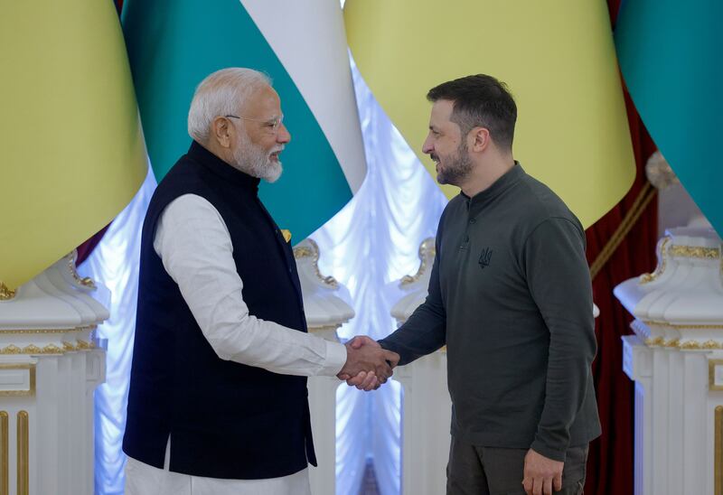 The leaders shake hands at the end of a signing ceremony during their meeting in Kyiv. Photograph: Sergey Dolzhenko/EPA