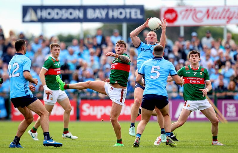 Ciaran Kilkenny and Jordan Flynn clash during Dublin vs Mayo at Dr Hyde Park. Photograph: Ryan Byrne/Inpho