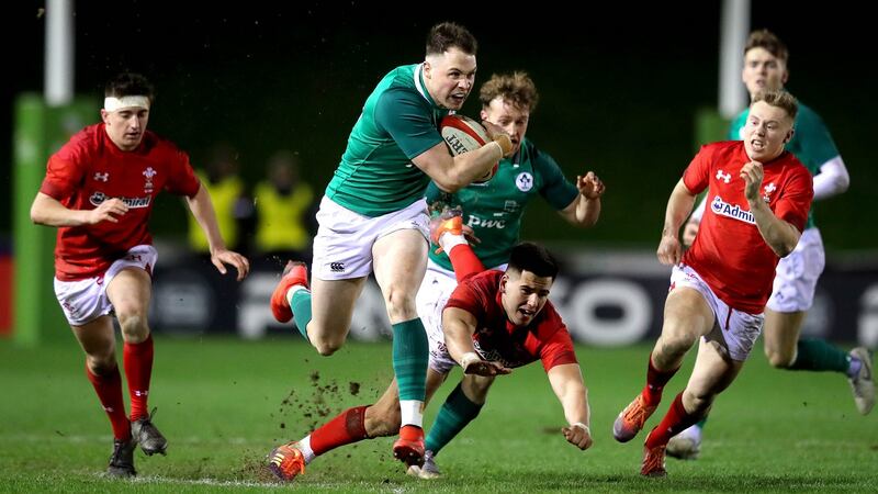 Ireland’s Seán French skips past Tiaan Thomas-Wheeler of Wales during the Under-20 Six Nations match in  Colwyn Bay. Photograph: Ryan Byrne/Inpho