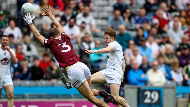 Kildare’s Tony Archbold kicks a point past Kevin Maguire of Westmeath during the Leinster SFC semi-final at Croke Park. Photograph: Evan Treacy/Inpho