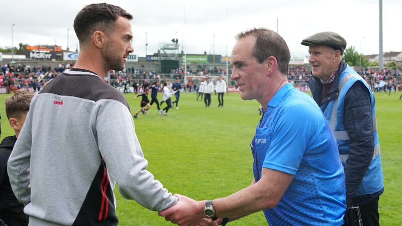 Down manager Conor Laverty shakes hands with referee David Coldrick after Sunday's game against Monaghan. Photograph: James Lawlor/Inpho