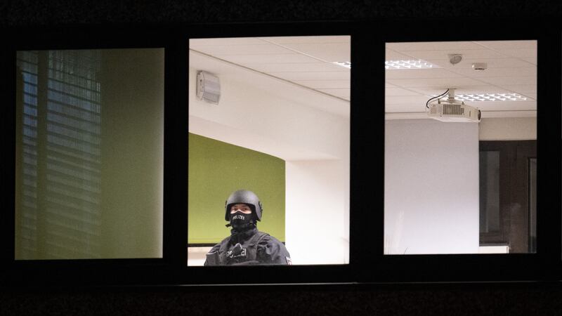 A member of the bomb defusing team inside Kingdom Hall, a plain office block opposite occupied by a local branch of the Jehova’s Witnesses. Photograph: Daniel Reinhardt/AFP via Getty Images)