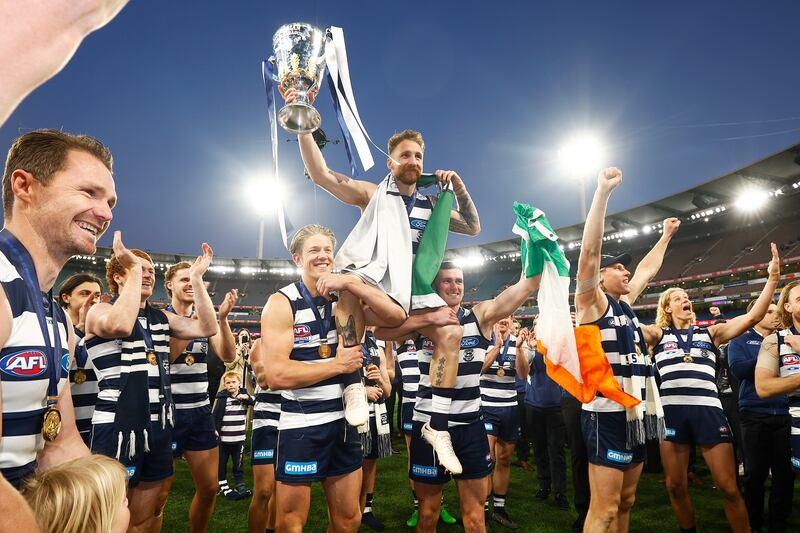 Zach Tuohy is carried off the pitch by team-mates after playing his 250th game, winning the AFL Grand Final match between the Geelong Cats and the Sydney Swans at the Melbourne Cricket Ground on September 24th, 2022 in Melbourne. Photograph: Daniel Pockett/AFL Photos/via Getty Images