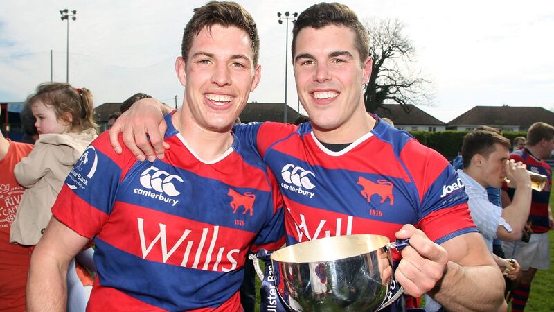Clontarf’s Adrian Darcy and Timmy McCoy celebrate with the league cup in 2014. Photograph: Colm O’Neill/Inpho