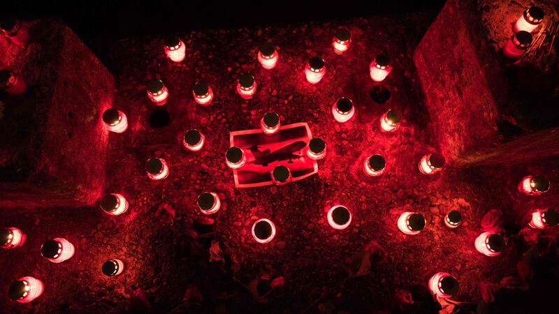 Candles are placed around  a picture of the  lost TU-154 plane at the seafront at the Russian city of Sochi after it crashed, with 92 people thought to have died.  Photograph: Ekaterina Lyzlova/AFP/Getty Images