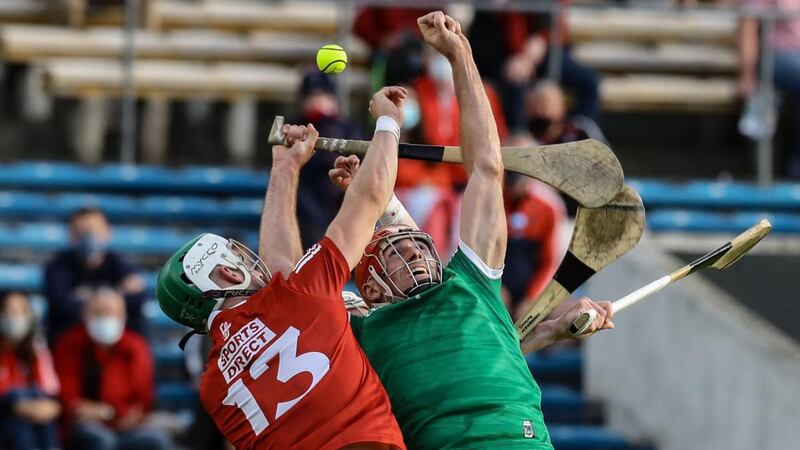 Limerick’s Barry Nash and Shane Kingston of Cork challenge for the ball during the Munster semi-final. Photograph:  Lorraine O’Sullivan/Inpho