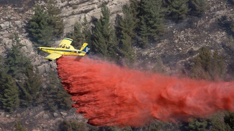 An Israeli firefighter plane helps extinguish a forest fire in the Jerusalem mountain near Kibbutz Neve Ilan, northwest of Jerusalem. Photograph: Menahem Kahana/AFP/Getty Images