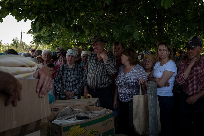 Residents await the distribution of humanitarian aid in the village of Novoselivka, Ukraine, near the border with Russia, on June 10th. Photograph: Nicole Tung/New York Times