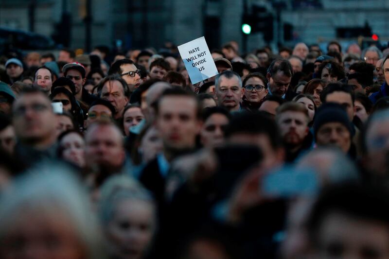 A member of the public holds up a sign reading “hate will not divide us” during a vigil in Trafalgar Square in central London on March 23, 2017 in solidarity with the victims of the March 22 terror attack at the British parliament and on Westminster Bridge. Photograph: Adrian Dennis/AFP/Getty Images