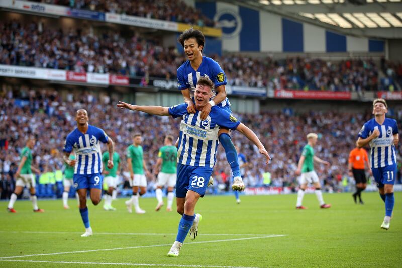 Ferguson celebrates with Brighton teammate Kaoru Mitoma after scoring his third goal against Newcastle United on September 2nd, 2023. Photograph: Steve Bardens/Getty