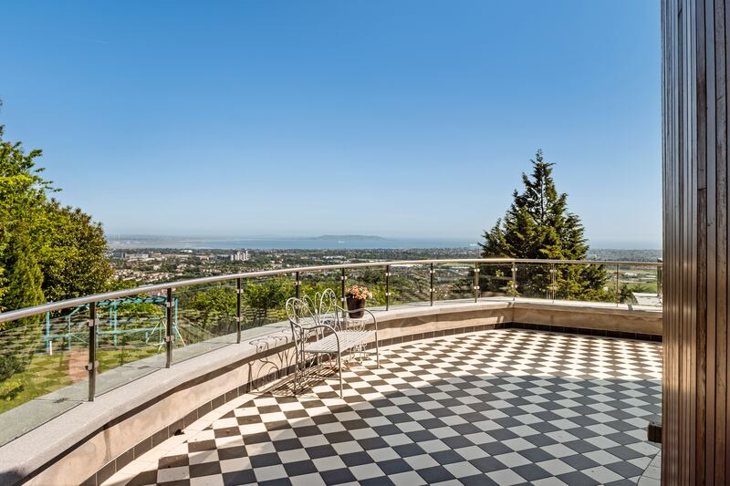 A balcony lies off the entertaining rooms upstairs 