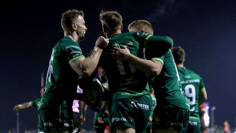 Connacht’s John Porch celebrates scoring a try with Matt Healy and Kyle Godwin. Photograph: Bryan Keane/Inpho