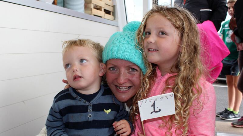 Heather Clatworthy with her childern Basil and Lily, after she became the first swimmer in almost 90 years to cross a 13-mile stretch of sea between two coastal beauty spots off Ireland’s north coast. Photograph: Chris Holmes/PA Wire