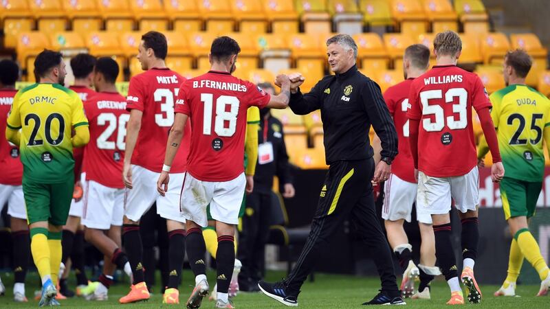 Ole Gunnar Solskjaer and Bruno Fernandes after Manchester United’s extra-time win over Norwich. Photograph: Joe Giddens/Getty/AFP